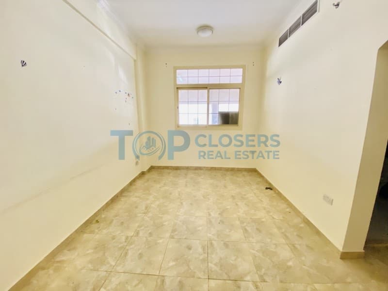 Spacious 1BHK | Central Duct AC | Covered Parking - Image 1